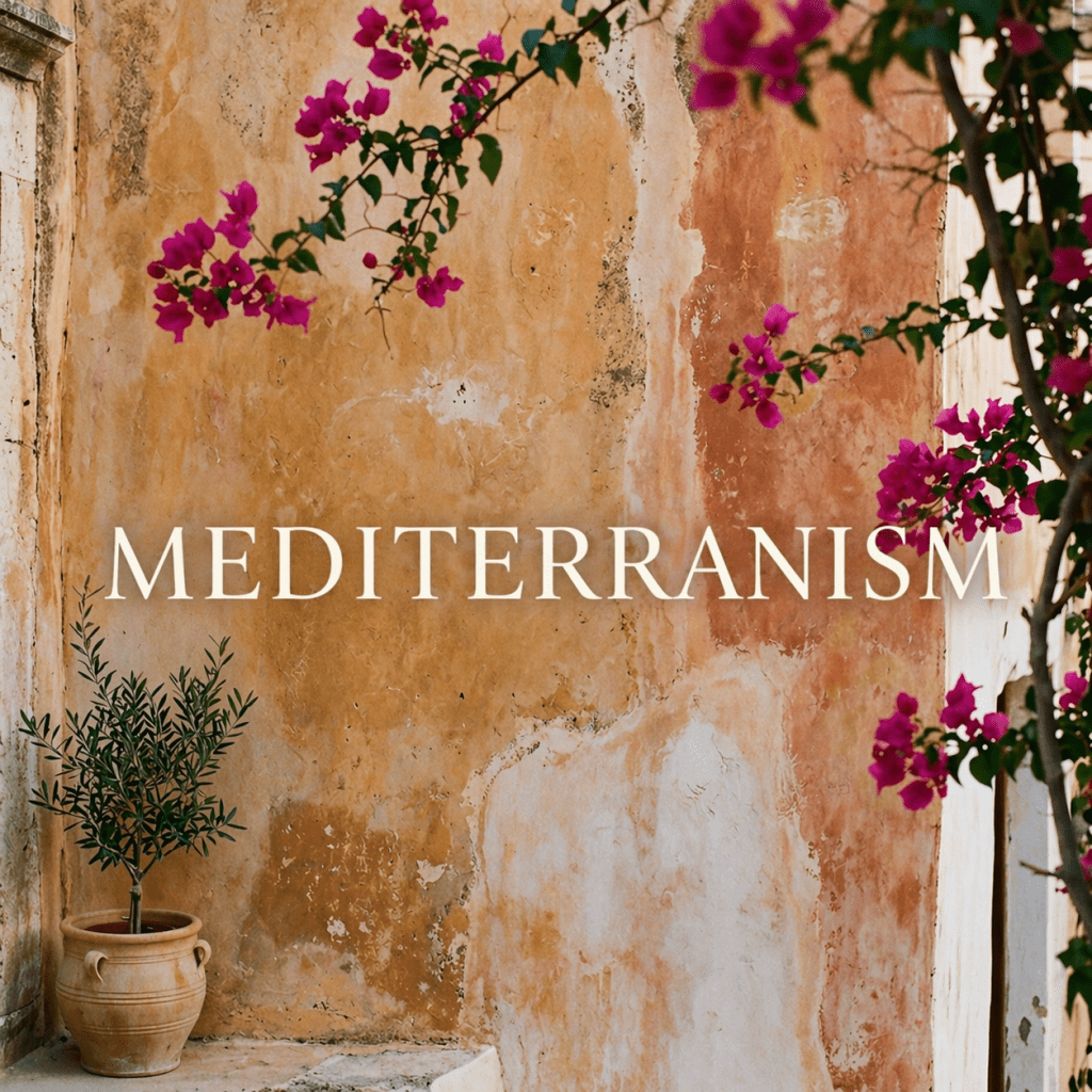 MEDITERRANISM wordmark in classical serif lettering on a warm Mediterranean wall with bougainvillea and an olive tree